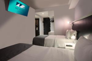 Cama ou camas em um quarto em Hotel WZ Jardins