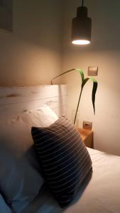A bed or beds in a room at FEEL LIKE HOME IN LESVOS