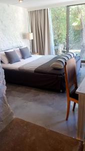 A bed or beds in a room at FEEL LIKE HOME IN LESVOS