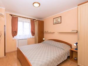Postel nebo postele na pokoji v ubytování Apartments Davorka