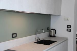 Virtuvė arba virtuvėlė apgyvendinimo įstaigoje CALLA, CALLUNA & GARDENIA APARTMENTS