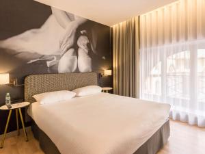 Un ou plusieurs lits dans un hébergement de l'établissement Ibis Styles Toulouse Capitole