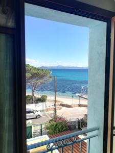 a view from a balcony of a balcony overlooking the ocean at Hotel Tabby in Golfo Aranci