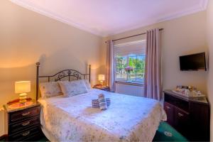 a bedroom with a large bed and a window at Fallon's B&B in Kinvara