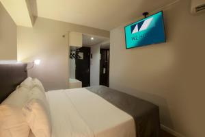 Cama ou camas em um quarto em Hotel WZ Jardins