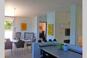a kitchen and living room with a table and chairs at Bride apartment Colonno in Colonno