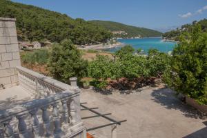 a balcony with a view of a body of water at Apartment Curri in Pučišća