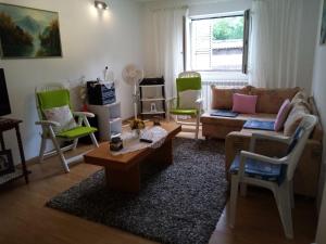 a living room with a couch and two chairs at Kuća za odmor Mendez in Labin