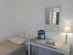 Posteľ alebo postele v izbe v ubytovaní B&B Giovannarolla Green House