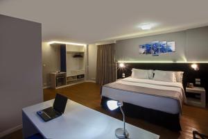 Cama ou camas em um quarto em Hotel WZ Jardins