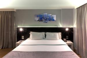 Cama ou camas em um quarto em Hotel WZ Jardins
