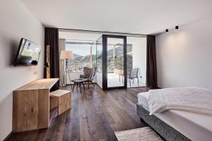 Ένα ή περισσότερα κρεβάτια σε δωμάτιο στο Haller Suites & Restaurant