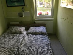 Postel nebo postele na pokoji v ubytování Balatongyöngye vendégház