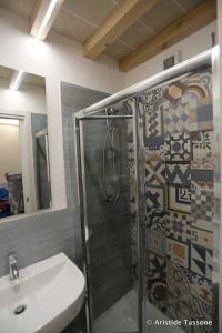 a bathroom with a shower and a sink at Il Ritrovo di Archimede in Favignana