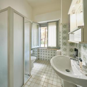 Koupelna v ubytování G/Hotel Lignano + 23 fotografií
