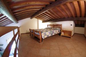 A bed or beds in a room at Agriturismo Il Palazzo