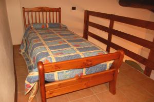A bed or beds in a room at Agriturismo Il Palazzo