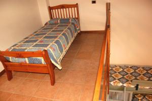 A bed or beds in a room at Agriturismo Il Palazzo