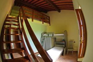 A bed or beds in a room at Agriturismo Il Palazzo