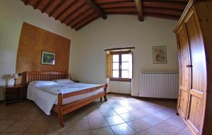 A bed or beds in a room at Agriturismo Il Palazzo Még 37 kép
