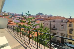 a view of a city from a balcony at Moderna in Coimbra