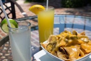 a bowl of food sitting on a table with a drink at Quinta San Carlos in San Pedro Tesistán