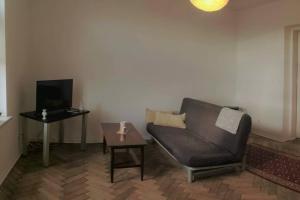 a living room with a couch and a table at Apartament Barbara - przy rynku in Wadowice