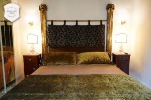 Posteľ alebo postele v izbe v ubytovaní Granda Sweet Suites