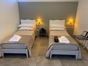 מיטה או מיטות בחדר ב-Cappellanio Suite & Apartament