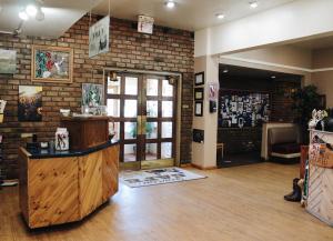 a room with a brick wall and a wooden door at Days Inn by Wyndham Show Low in Show Low