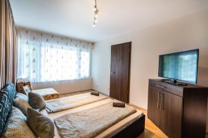 Posteľ alebo postele v izbe v ubytovaní Siesta Sziget - Balaton-parti Apartmanok