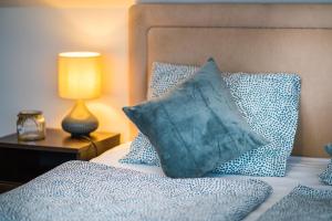 Posteľ alebo postele v izbe v ubytovaní Siesta Sziget - Balaton-parti Apartmanok