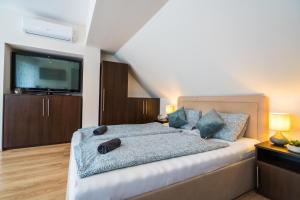 Posteľ alebo postele v izbe v ubytovaní Siesta Sziget - Balaton-parti Apartmanok