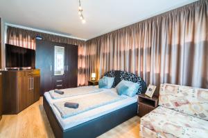 Posteľ alebo postele v izbe v ubytovaní Siesta Sziget - Balaton-parti Apartmanok
