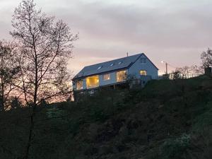 a house sitting on top of a hill at L'Auf der Tomm in Martelange