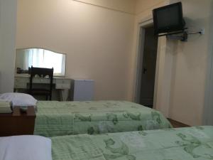 Postel nebo postele na pokoji v ubytování Lux Hotel