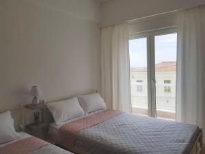 A bed or beds in a room at Harmony Apartment Kavala