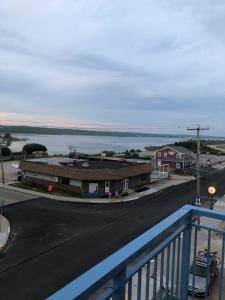 a view of a street with a building and the ocean at Misquamicut Beach Front Inn in Misquamicut