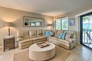 a living room with a couch and a table at Anna Maria Island Resort Condo with Prime Location! in Bradenton Beach