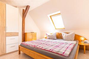 Postel nebo postele na pokoji v ubytování Ferienwohnung Am Walnussbaum