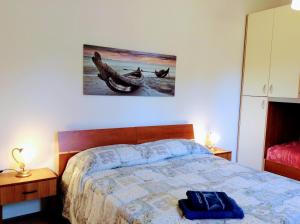 Postel nebo postele na pokoji v ubytování Il mirto e l'oleandro