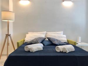 A bed or beds in a room at Beach apartments Isola d'Elba