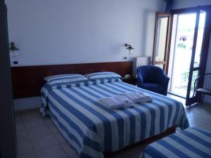 Postel nebo postele na pokoji v ubytování Hotel L'Ancora
