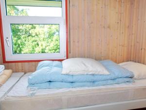 Postel nebo postele na pokoji v ubytování 7 person holiday home in Hemmet-By Traum