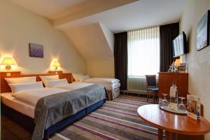 Lova arba lovos apgyvendinimo įstaigoje Sure Hotel by Best Western Ambassador Duesseldorf