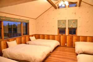 Postel nebo postele na pokoji v ubytování Kawaguchiko Cottage Minami + 19 fotografií