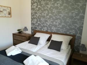 Posteľ alebo postele v izbe v ubytovaní Apartament Oaza Kołobrzeg-Podczele Kompleks Feniks basen siłownia jacuzii