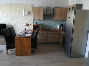 Kuchyňa alebo kuchynka v ubytovaní Apartament Oaza Kołobrzeg-Podczele Kompleks Feniks basen siłownia jacuzii