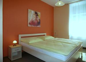 Ένα ή περισσότερα κρεβάτια σε δωμάτιο στο Homely Apartments Villa Christiana