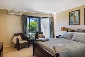 A bed or beds in a room at Yarrandabbi Dreaming Boutique B&B